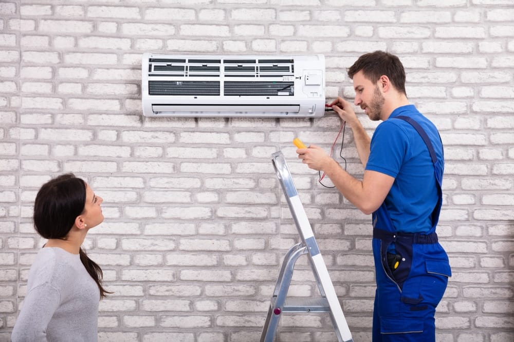 HVAC Technician servicing a mini-split system